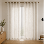 A pair of Pearl white textured grommet curtains hanging on a gold curtain rod in a bright, modern room setting.