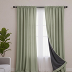 Room darkening curtains with a sage green outer layer for modern interiors