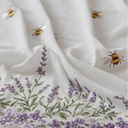 Linen fabric with lavender and bee designs on a white background