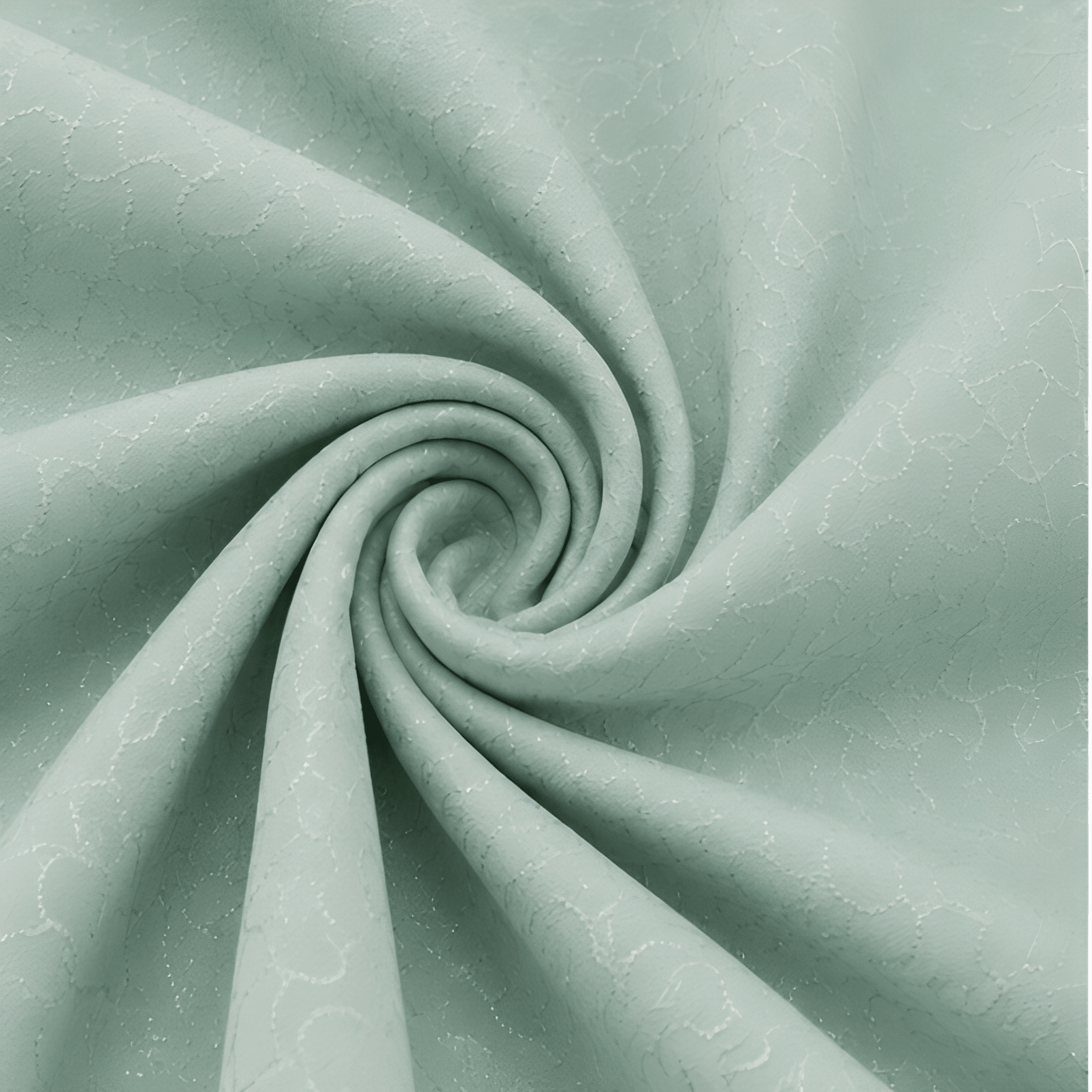 A close-up of mint green fabric arranged in a spiral drape, showing a subtle repeating tonal pattern.