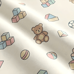 Pattern of colorful toys including a teddy bear on a light background
