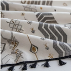 Set of patterned cloths with tassels on a white background